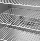 Summerset 24" 5.3c Outdoor Rated Refrigerator interior with adjustable wire shelves and halogen lighting.